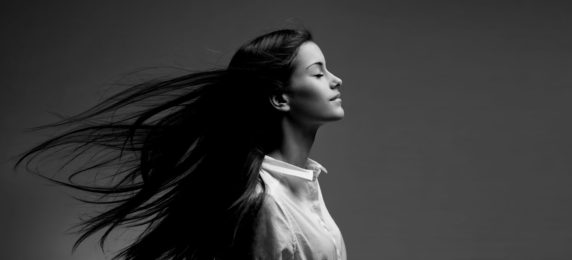 Brunette beauty with windswept hair.